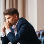 Young lawyer waits in the lobby at Blair Wellness Group for his relationship counseling appointment.