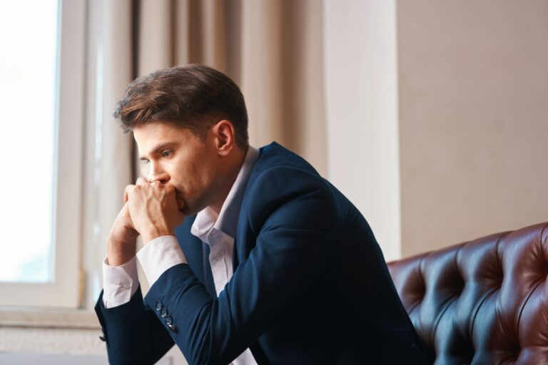 Young lawyer waits in the lobby at Blair Wellness Group for his relationship counseling appointment.