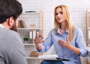 Psychologist,Having,Session,With,Her,Patient,In,Office,,Giving,Him